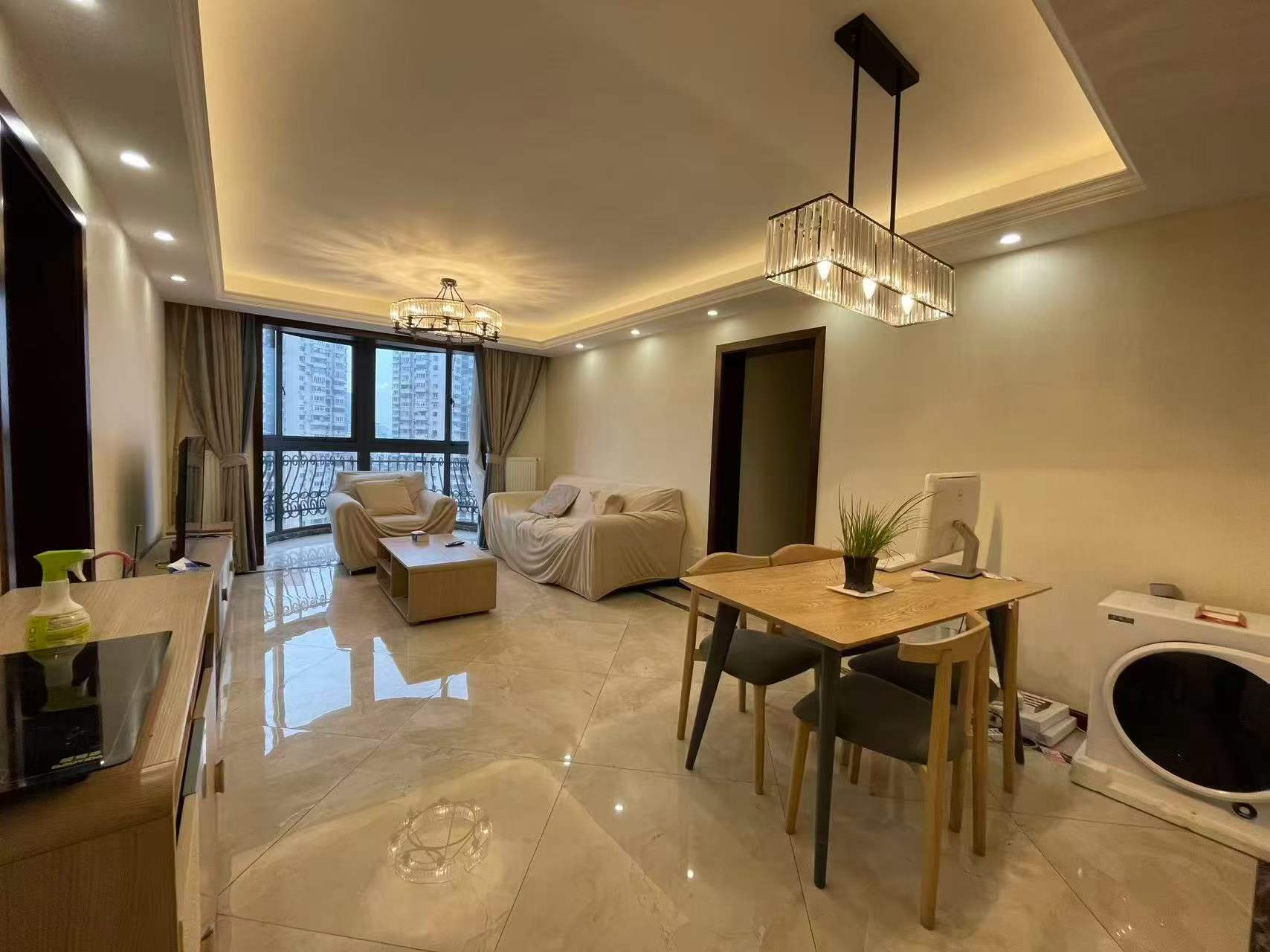 4-bed, 2-bath unit at Haisi Tower on Huashan Road. Central AC, wall heating, city views, 5 min walk to Jiaotong University Station. 22,000 RMB/month.