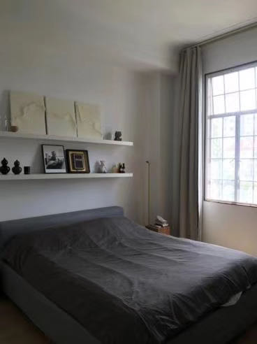 2-bed, 1-bath unit at Zhenliu Apartment on Huashan Road. 1930 heritage elevator building with 2,500 sqm garden, high ceilings. Home to Zhou Xuan. 23,000 RMB/month.