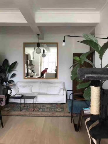 2-bed, 1-bath unit at Zhenliu Apartment on Huashan Road. 1930 heritage elevator building with 2,500 sqm garden, high ceilings. Home to Zhou Xuan. 23,000 RMB/month.