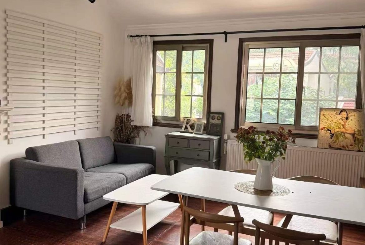 2-bed, 1-bath unit at Aitang Xincun on YUqing Road. 100 sqm, private terrace, heritage building, owner direct. Near Shanghai Library Station. 18,000 RMB/month.