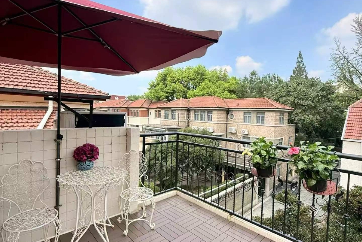 2-bed, 1-bath unit at Aitang Xincun on YUqing Road. 100 sqm, private terrace, heritage building, owner direct. Near Shanghai Library Station. 18,000 RMB/month.