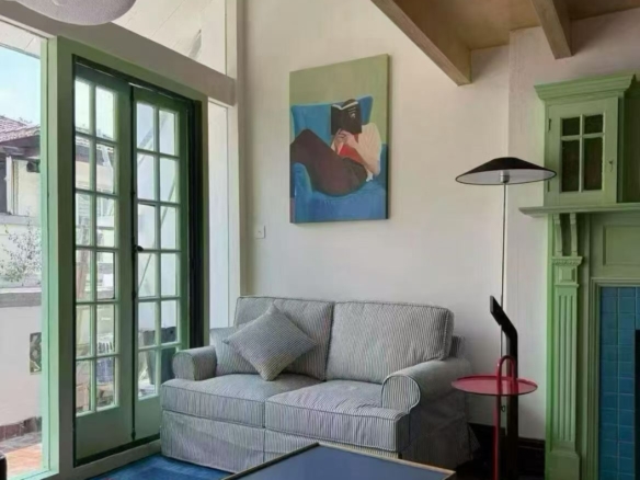 2-bed, 2-bath unit on Nanchang Road near Huaihai Road. 100 sqm, balcony, terrace, south-facing, quiet lane. Near Line 13 station. 14,500 RMB/month.