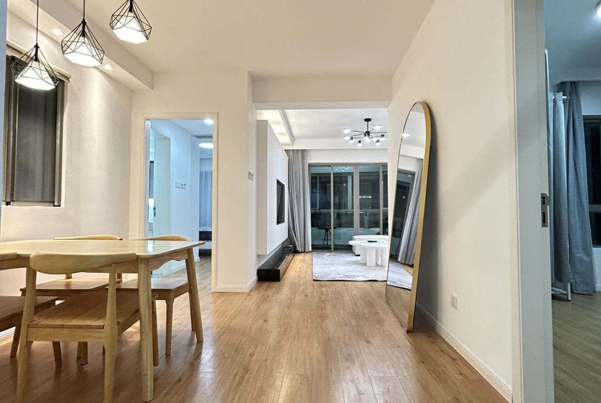 2-bed, 2-bath unit at One Park Avenue in Jing'an. 110 sqm, underfloor heating, central AC, oven, dishwasher. 50% greenery, clubhouse. 22,600 RMB/month.