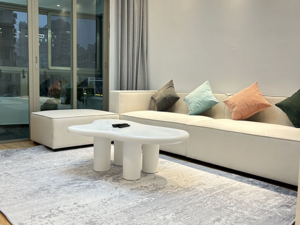 2-bed, 2-bath unit at One Park Avenue in Jing'an. 110 sqm, underfloor heating, central AC, oven, dishwasher. 50% greenery, clubhouse. 22,600 RMB/month.