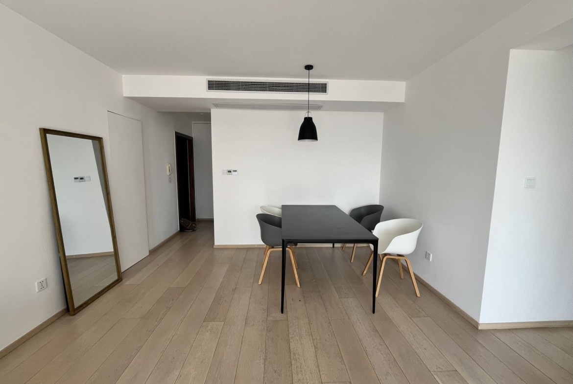 2-bed, 2-bath unit at Shanghai Grand Plaza on Julu Road. 114 sqm, underfloor heating, central AC, clubhouse with pool. 25,000 RMB/month.
