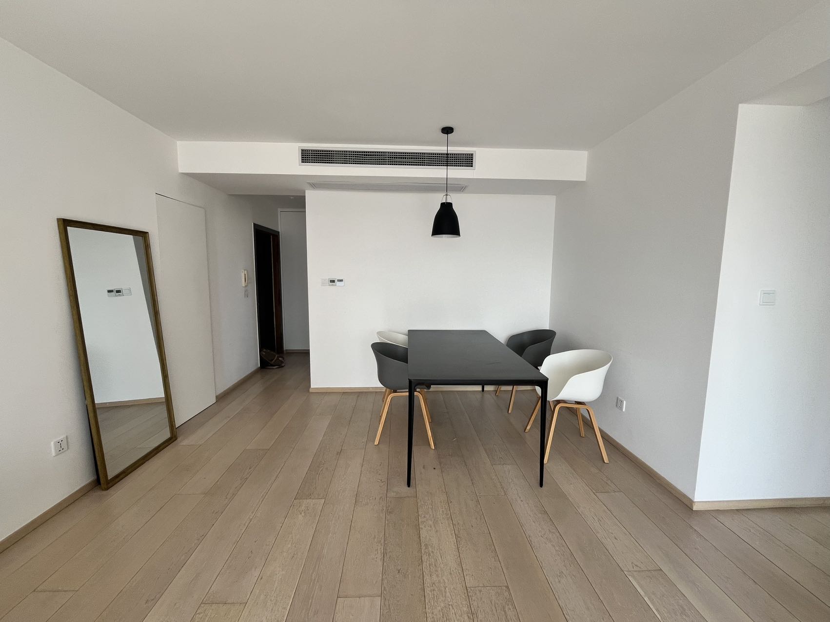 2-bed, 2-bath unit at Shanghai Grand Plaza on Julu Road. 114 sqm, underfloor heating, central AC, clubhouse with pool. 25,000 RMB/month.