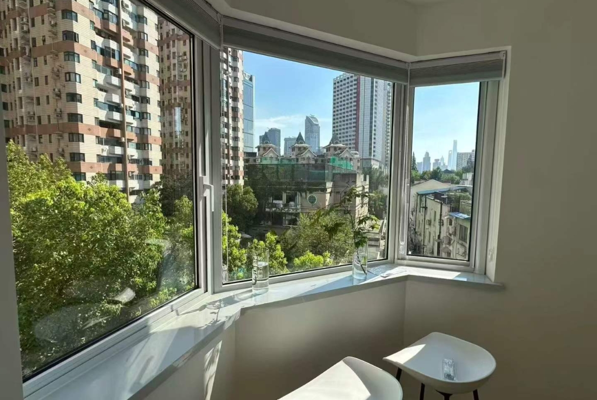 2-bed, 2-bath unit at Shanghai Grand Plaza on Julu Road. Fully furnished, bright unit, clubhouse with pool and gym. 18,000 RMB/month.