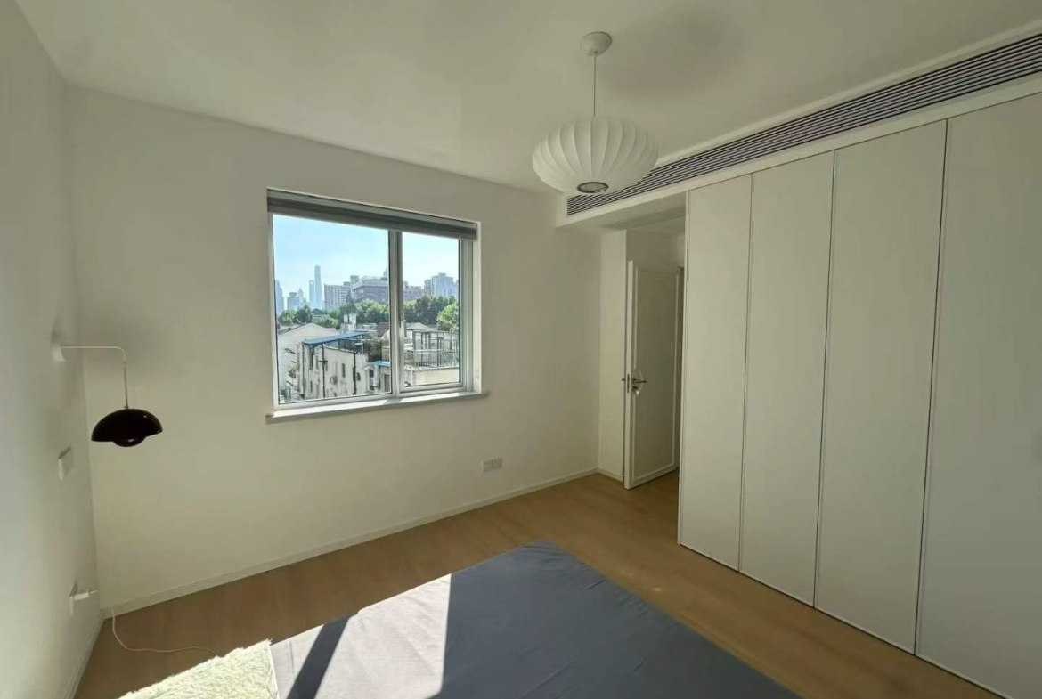 2-bed, 2-bath unit at Shanghai Grand Plaza on Julu Road. Fully furnished, bright unit, clubhouse with pool and gym. 18,000 RMB/month.