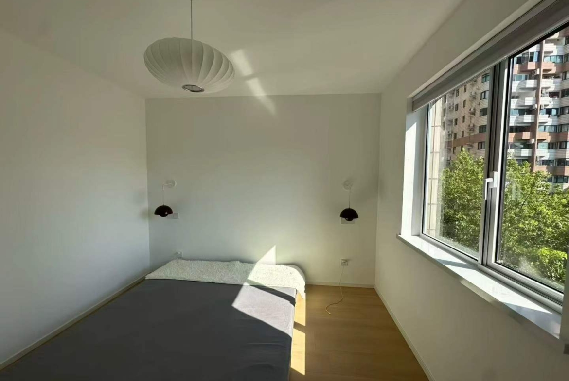 2-bed, 2-bath unit at Shanghai Grand Plaza on Julu Road. Fully furnished, bright unit, clubhouse with pool and gym. 18,000 RMB/month.