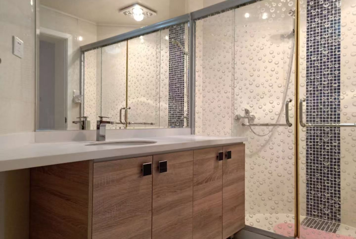 2-bed, 2-living, 1-bath unit at Territory Shanghai. 118 sqm, south-facing balcony, central Jing'an location near Nanjing West Road. 19,000 RMB/month.