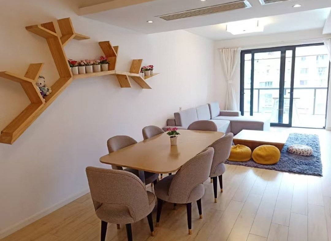 2-bed, 2-living, 1-bath unit at Territory Shanghai. 118 sqm, south-facing balcony, central Jing'an location near Nanjing West Road. 19,000 RMB/month.