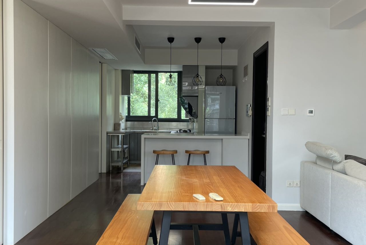 1+1 bedroom unit at Territory Shanghai with large terrace and open kitchen. 120 sqm, central Jing'an location, well-finished. Available July. 22,000 RMB/month.