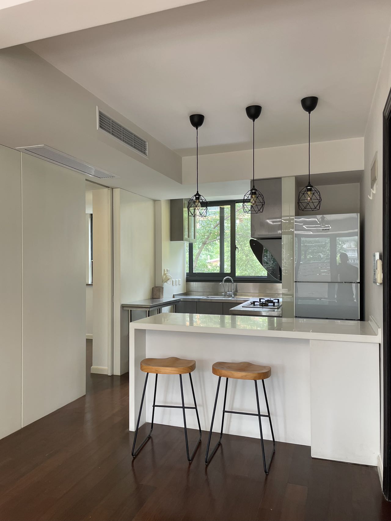 1+1 bedroom unit at Territory Shanghai with large terrace and open kitchen. 120 sqm, central Jing'an location, well-finished. Available July. 22,000 RMB/month.