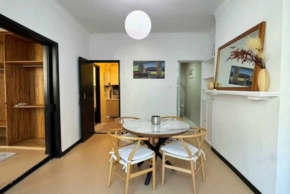 1-bed, 1-bath heritage unit on Wuyuan Road. South-facing bedroom and living room, bright, one unit per floor, owner direct. 9,800 RMB/month.