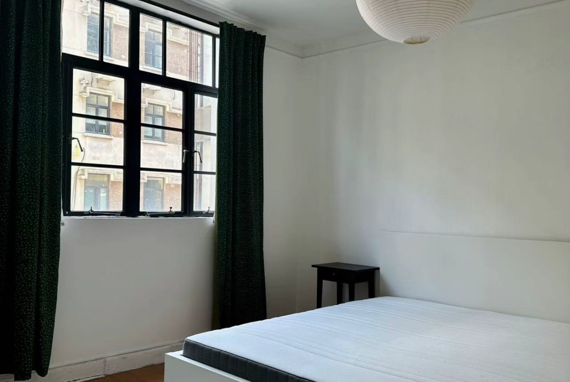 1-bed, 1-bath heritage unit on Wuyuan Road. South-facing bedroom and living room, bright, one unit per floor, owner direct. 9,800 RMB/month.