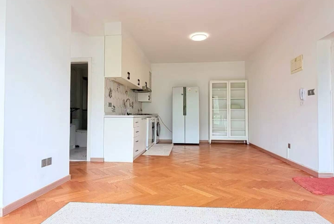 2-bed, 2-bath heritage unit on Xingguo Road with large terrace. 120 sqm, quiet FFC border location. 22,800 RMB/month.