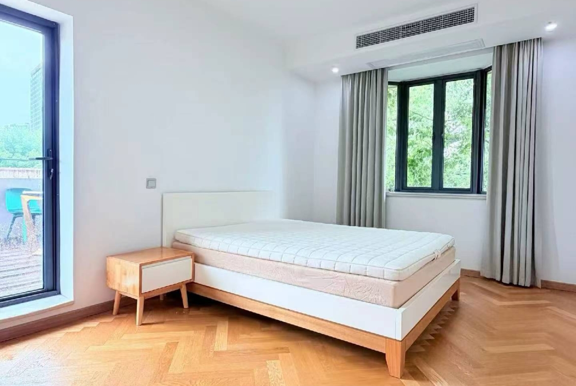 2-bed, 2-bath heritage unit on Xingguo Road with large terrace. 120 sqm, quiet FFC border location. 22,800 RMB/month.