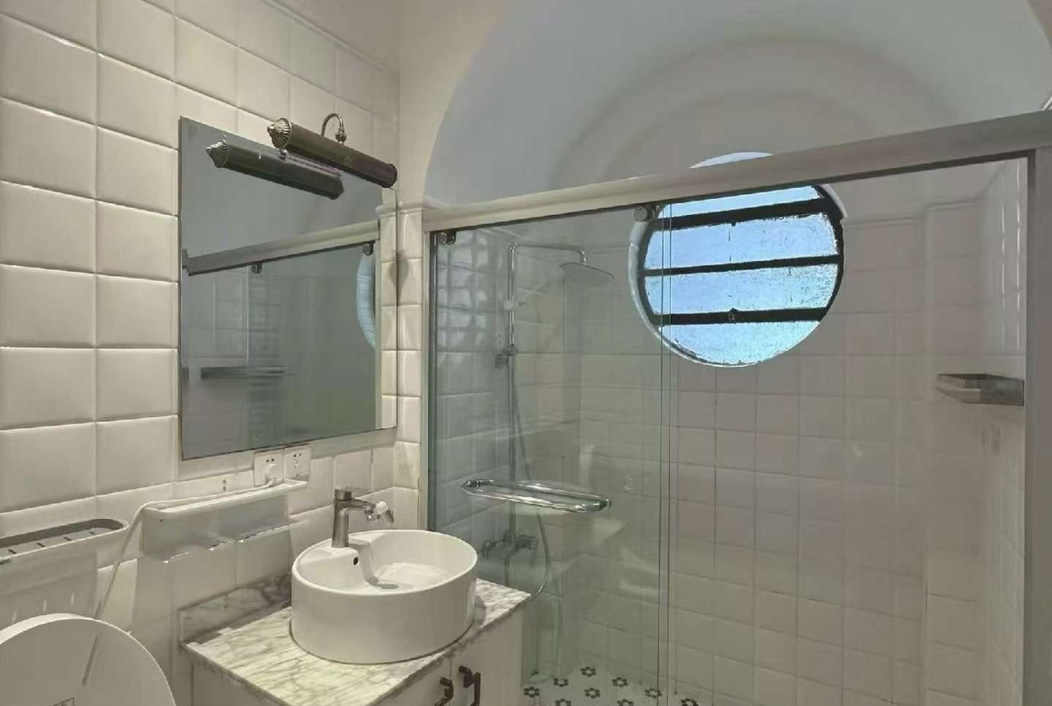 1-bed, 1-bath lane house on Yueyang Road with sunroom and private terrace. Heritage FFC location. 15,800 RMB/month.