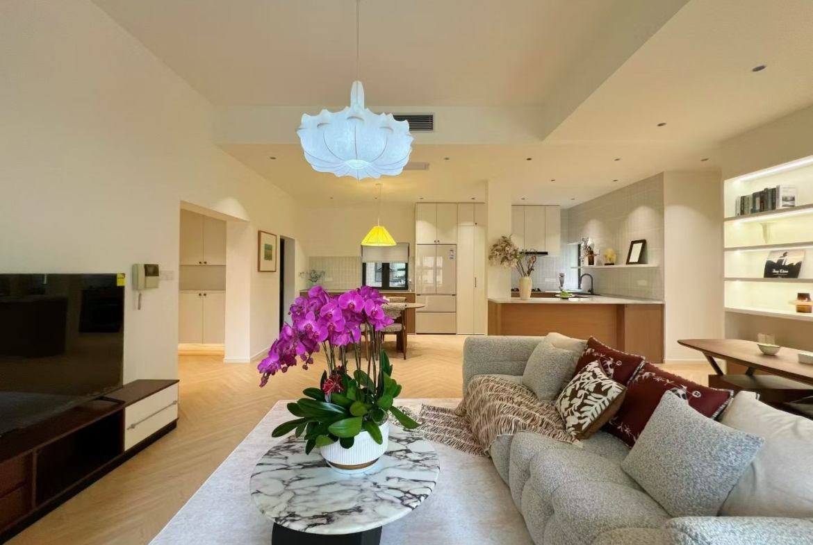 3-bed, 2-bath unit at Ambassy Court on Huaihai Road. 160.2 sqm, 3 balconies, 3.2m ceilings, underfloor heating, central AC, French luxury renovation. 42,000 RMB/month.