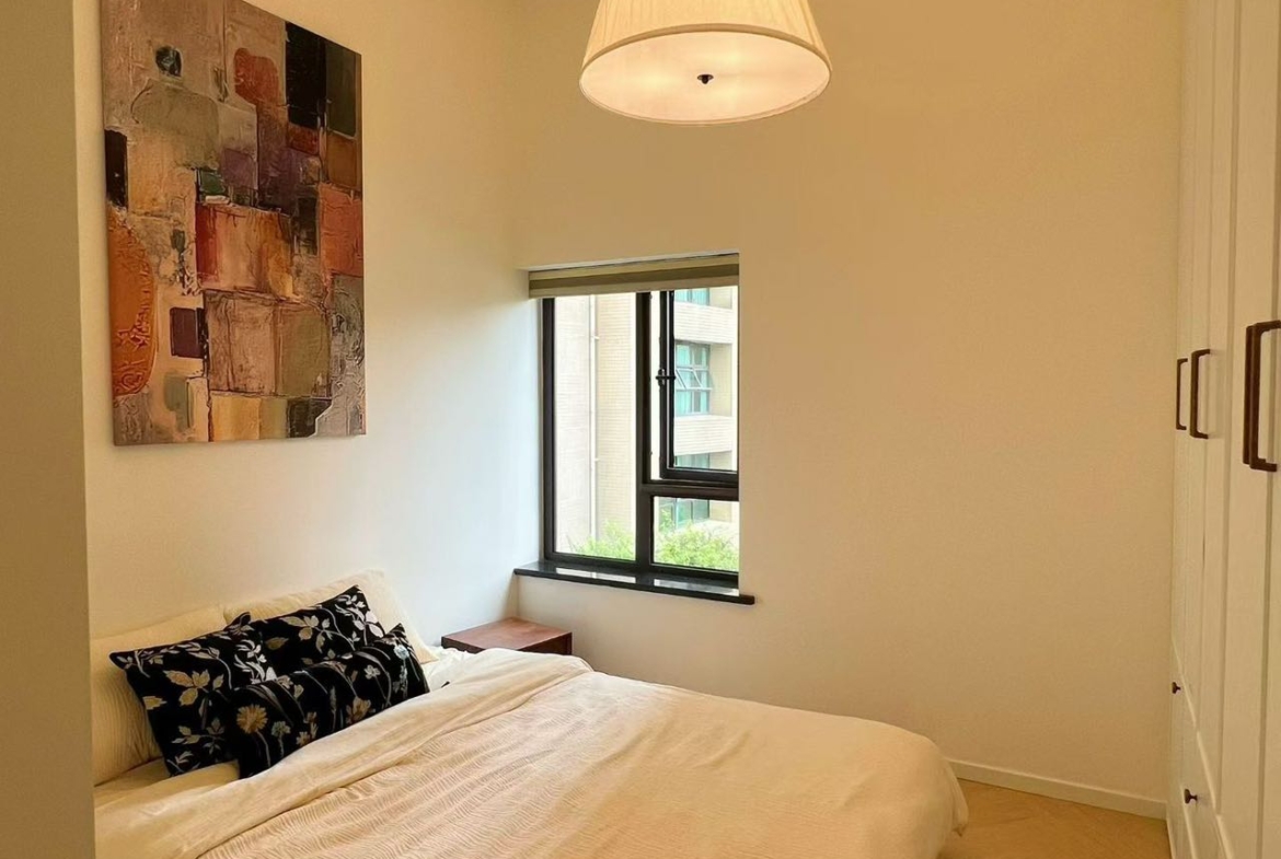 3-bed, 2-bath unit at Ambassy Court on Huaihai Road. 160.2 sqm, 3 balconies, 3.2m ceilings, underfloor heating, central AC, French luxury renovation. 42,000 RMB/month.
