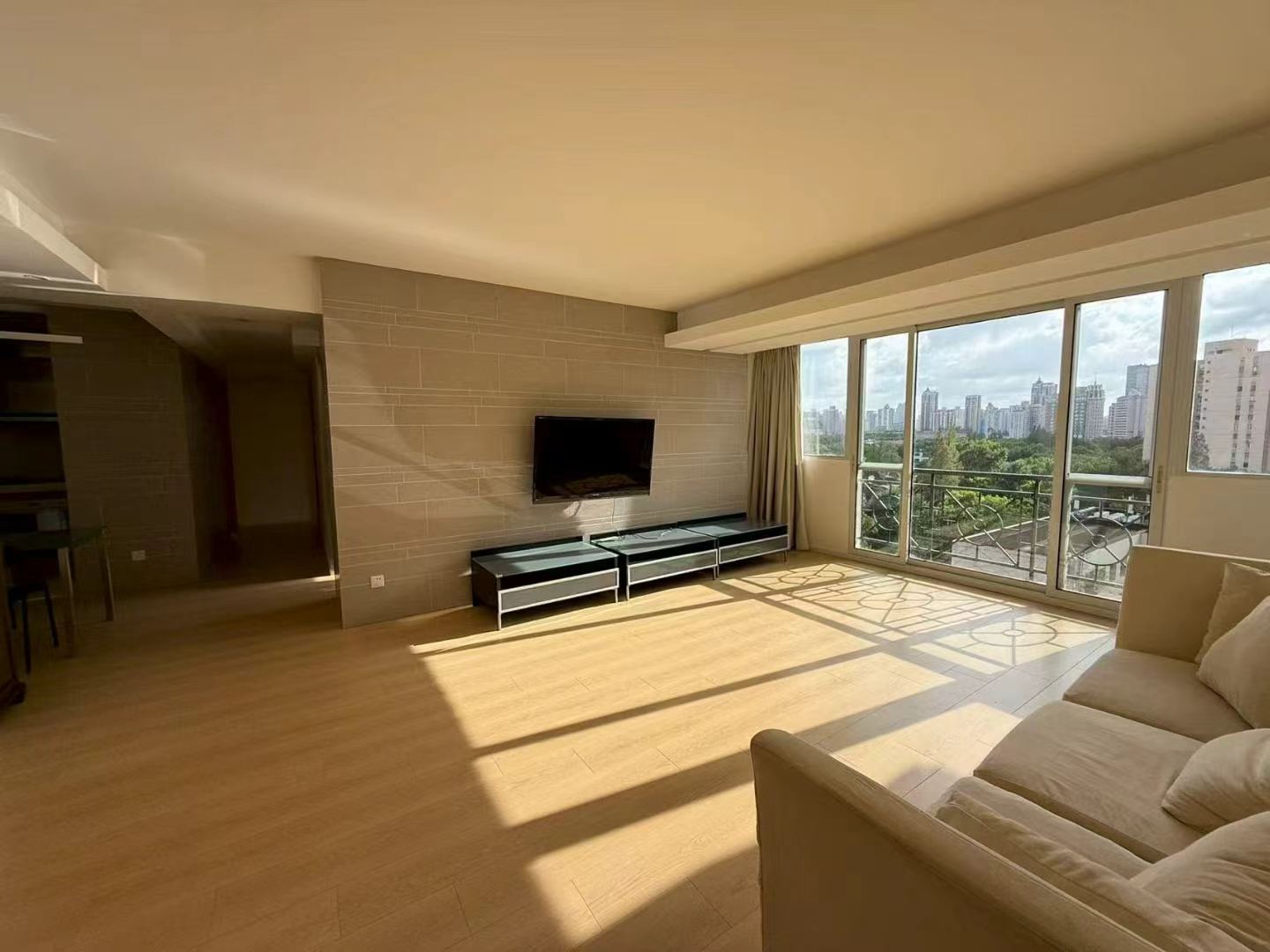 2-bed, 2-bath unit at Xuhui Yipinyuan on Anfu Road. Both bedrooms south-facing, panoramic living room windows, full underfloor heating. 28,000 RMB/month.