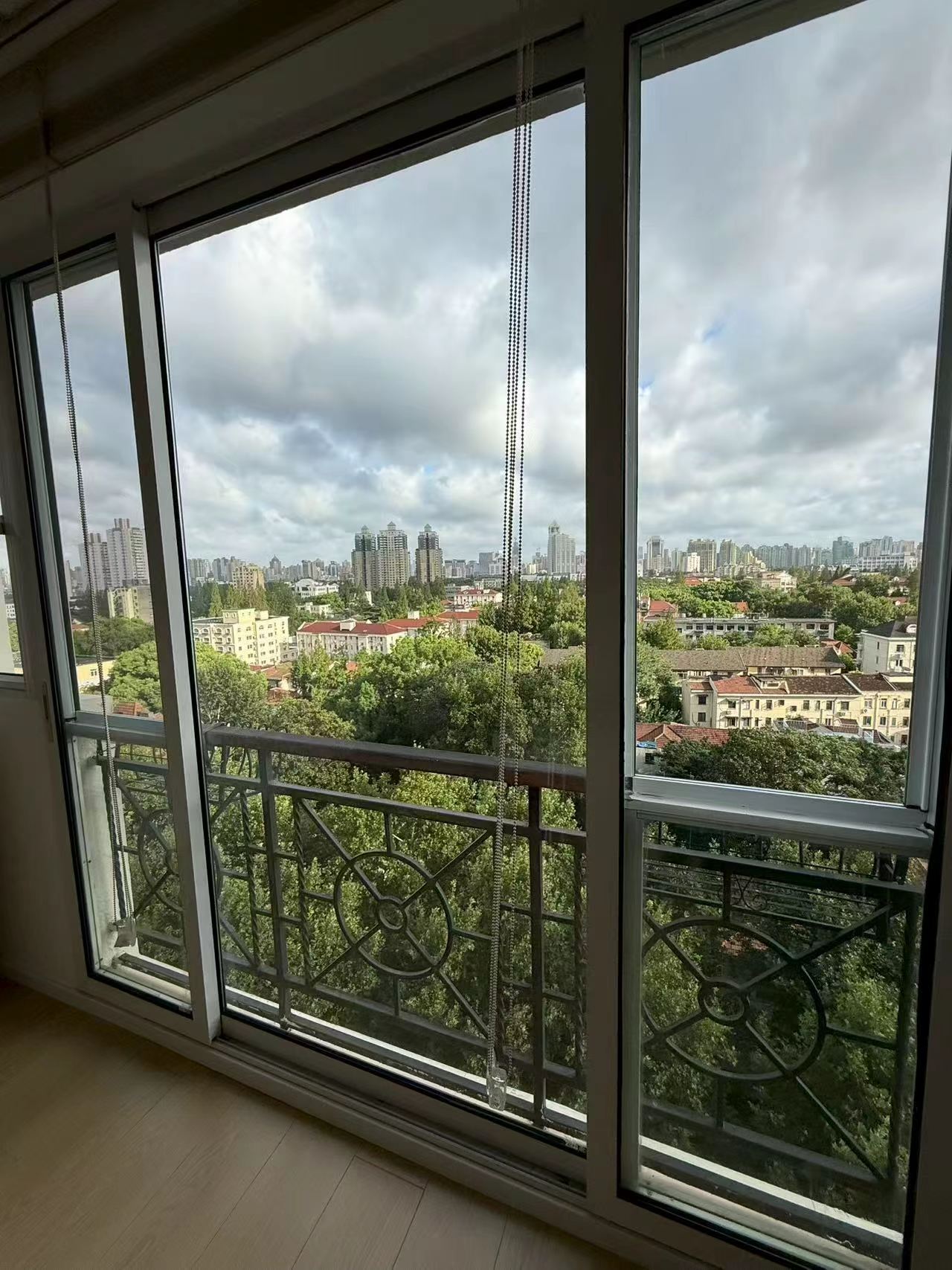 2-bed, 2-bath unit at Xuhui Yipinyuan on Anfu Road. Both bedrooms south-facing, panoramic living room windows, full underfloor heating. 28,000 RMB/month.