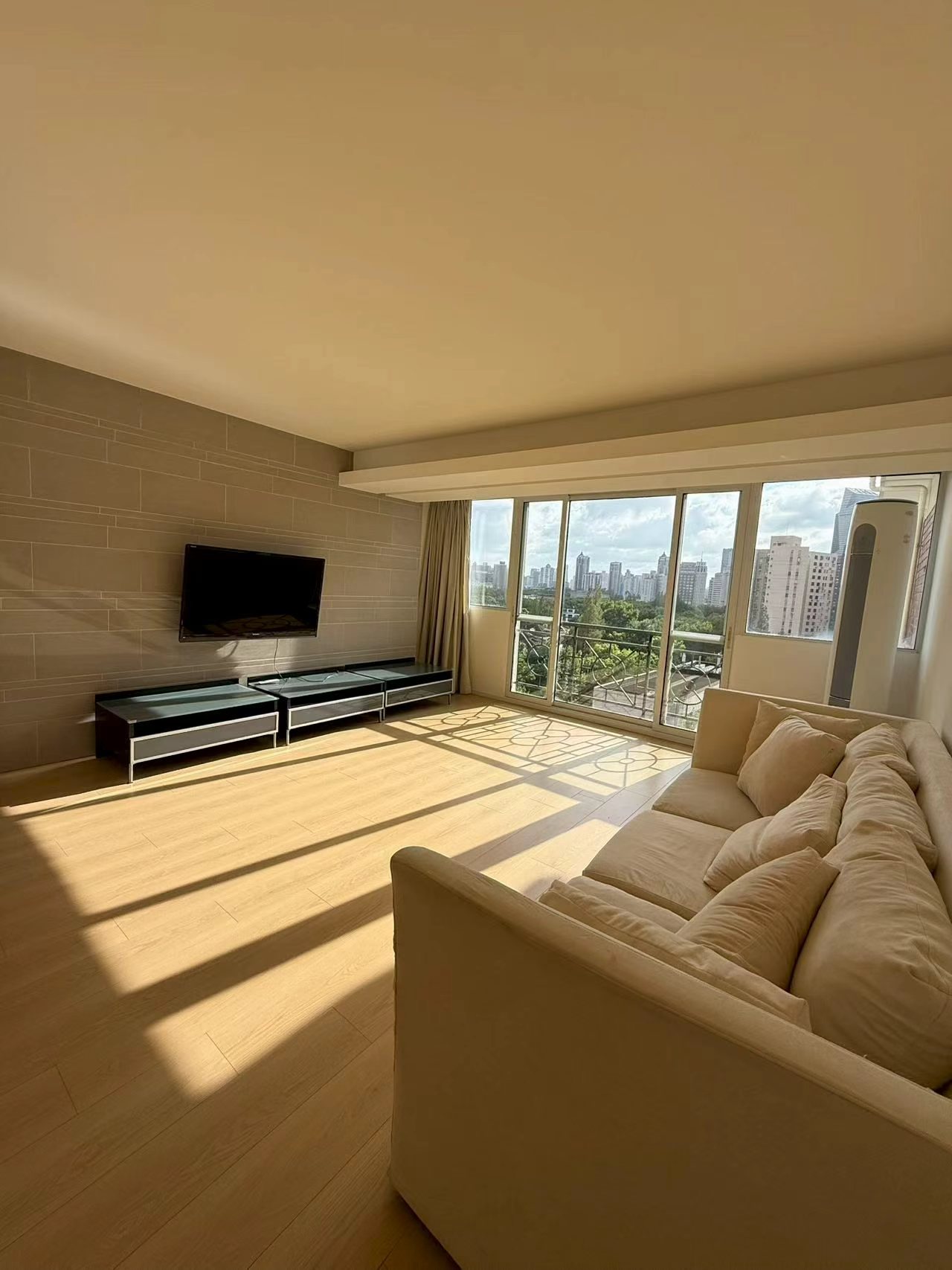 2-bed, 2-bath unit at Xuhui Yipinyuan on Anfu Road. Both bedrooms south-facing, panoramic living room windows, full underfloor heating. 28,000 RMB/month.