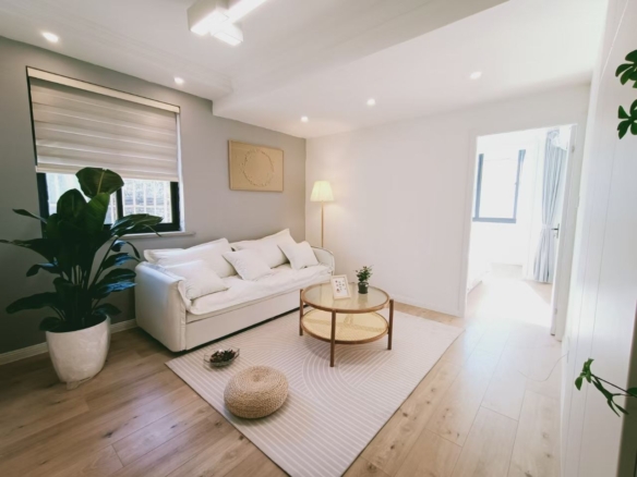 1-bed, 1-bath lane house near Jiangsu Road Station. 45 sqm, corner unit, fully bright, large balcony, oven, washer-dryer. 7,900 RMB/month.