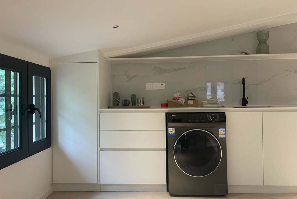 2-bed, 1-bath lane house on Anting Road. 63 sqm, central AC, dishwasher, full service package including cleaning and maintenance. 14,850 RMB/month.