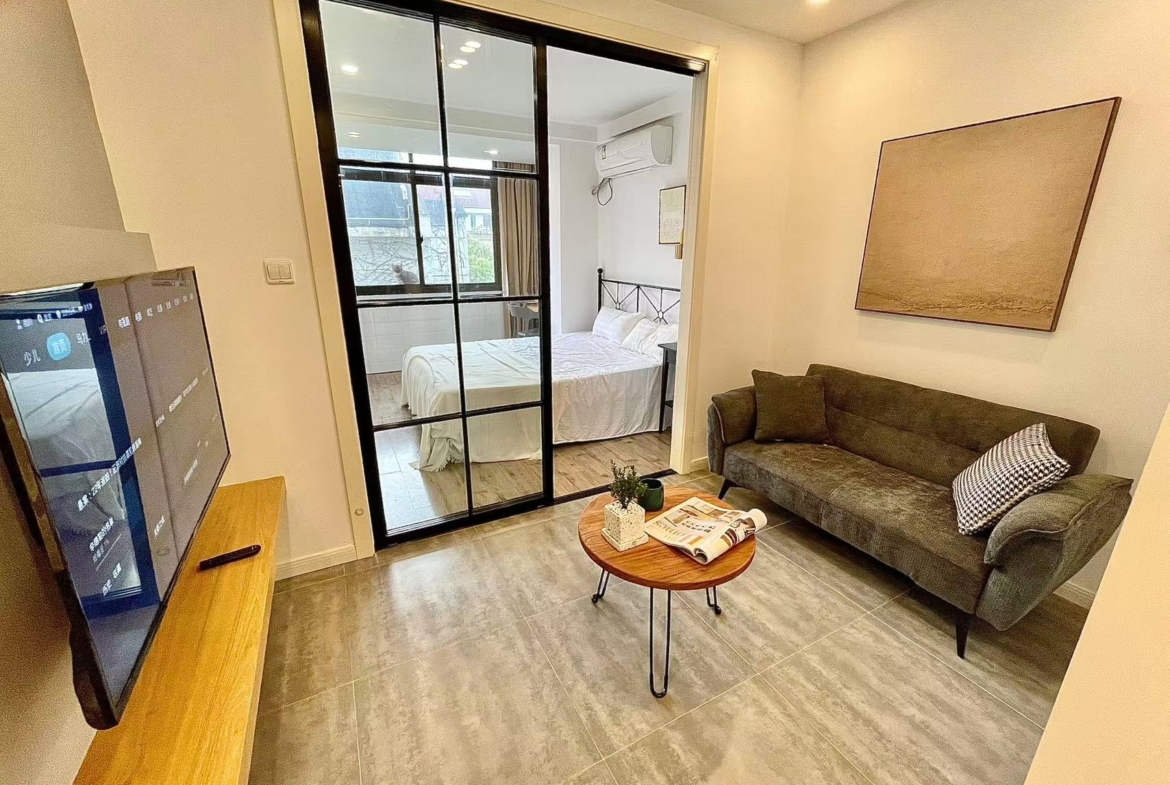 2-bed, 2-living unit near Loushanguan Road Station. 60 sqm, north-south through, washer-dryer, large storage, smart lock. 8,500 RMB/month