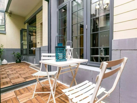 Entire new-style lane house on Jiaozhou Road in Jing'an. 6 beds, 3 baths, 245 sqm, 15 sqm courtyard, 20 sqm terrace, live or work. 35,000 RMB/month.