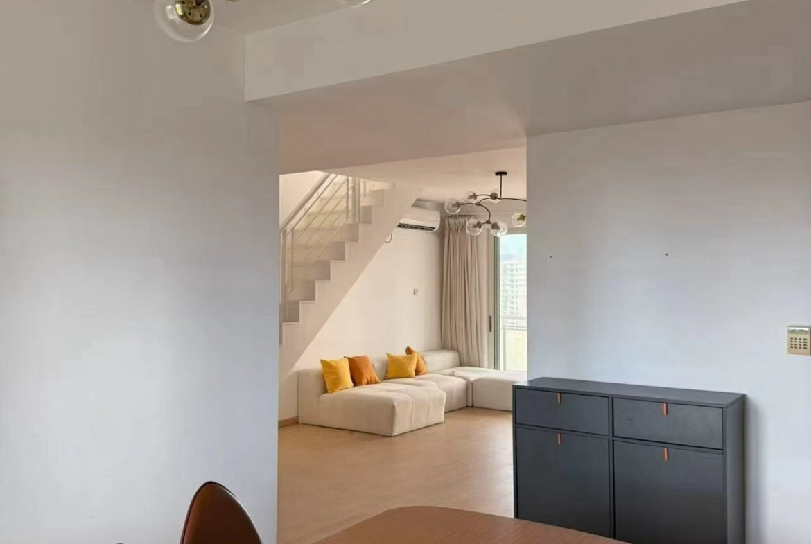 Penthouse unit at La Cite in Xujiahui. 155 sqm, 3 beds, 2 baths, storage room, 100 sqm private terrace. Steps from metro. 28,500 RMB/month.