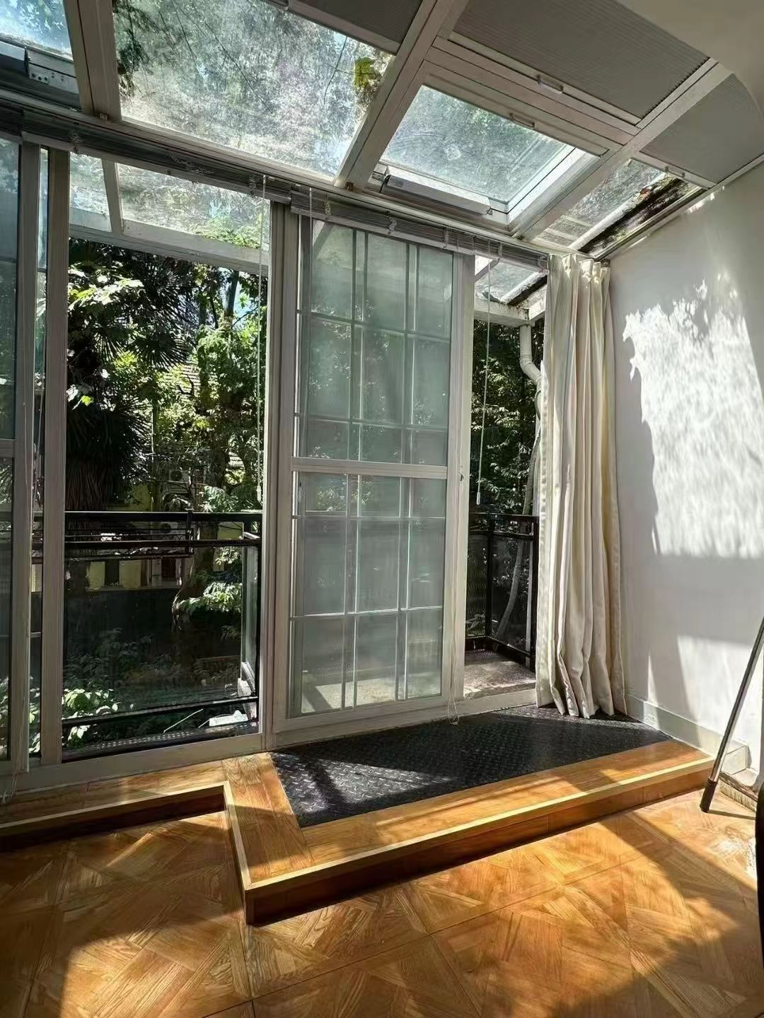 2-bed, 2-bath garden unit on Pingwu Road. 3.3m ceilings, north-south through, wall heating, garden views. 13,000 RMB/month.
