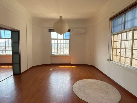 1-bed, 1-bath unit at Rui Hua Apartment on Changshu Road. 87 sqm, double south-facing, elevator, heritage building (1928), city views. 11,000 RMB/month.
