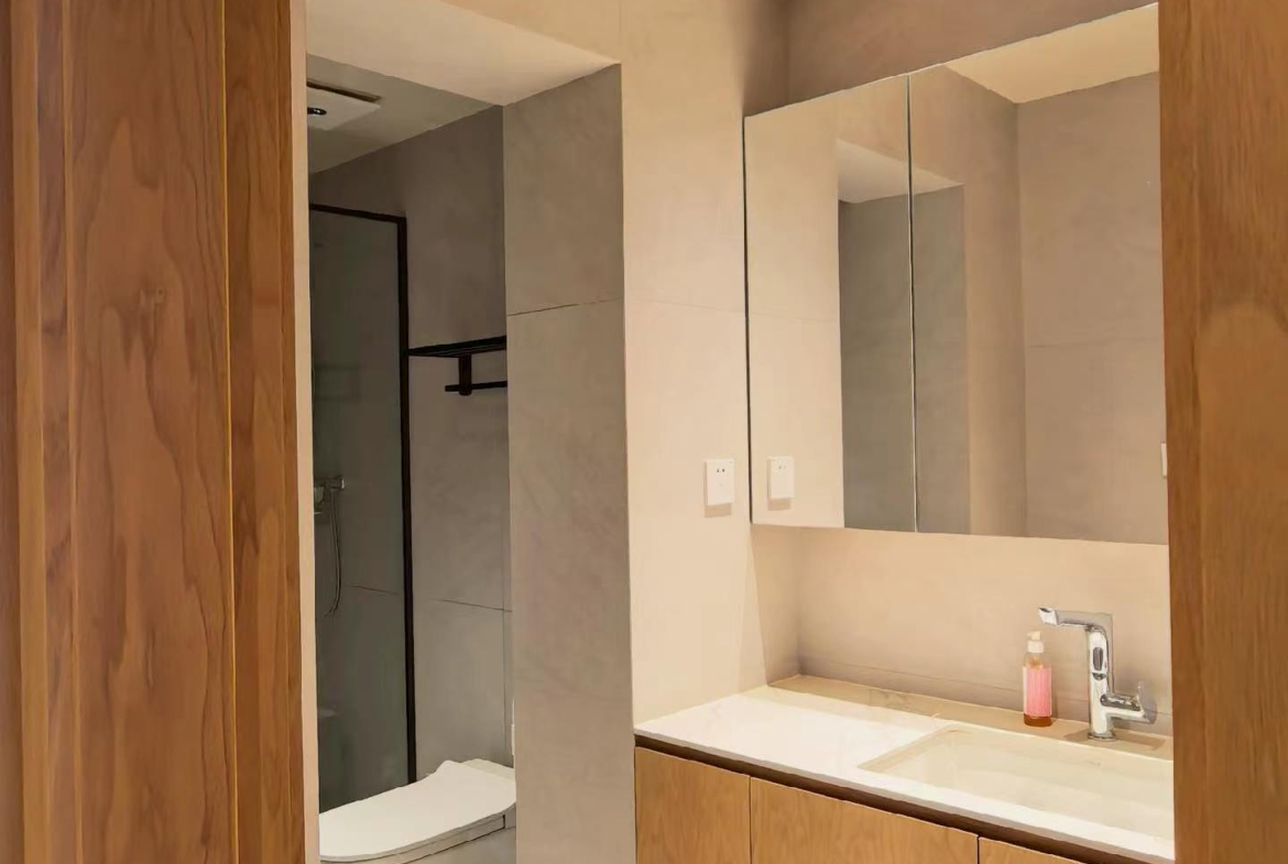 Ground floor lane house on Wuyuan Road with 60 sqm private garden and parking. 1 bed, 1 bath, fully renovated, live or work. 28,000 RMB/month.