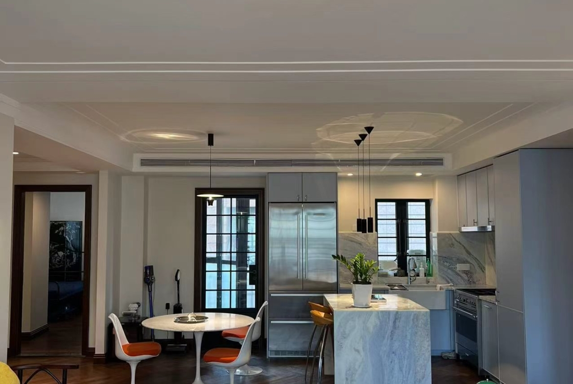3-bed, 2-bath unit at Changde Apartments, a 1936 Art Deco heritage building in Jing'an. 167 sqm, balconies, owner renovation, steps from Jing'an Temple. 45,000 RMB/month.