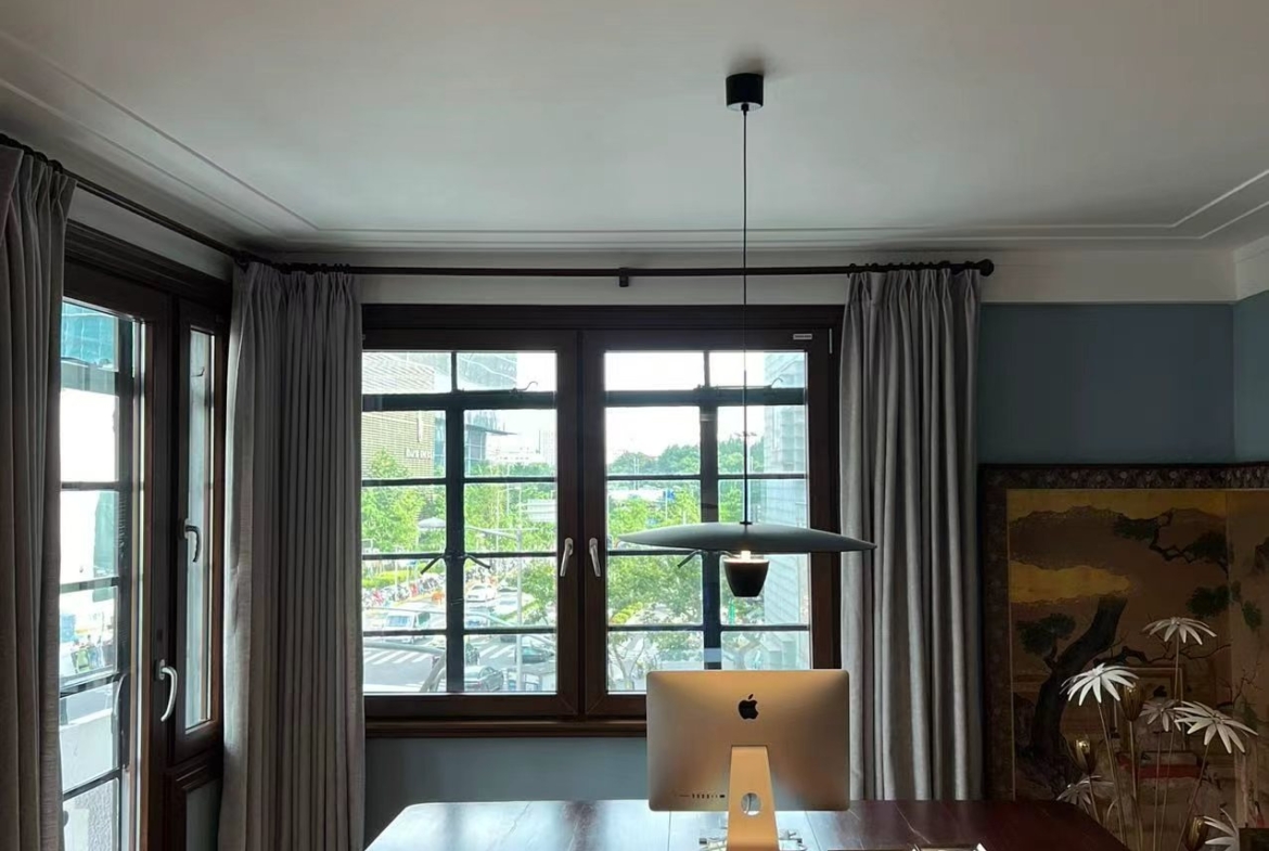 3-bed, 2-bath unit at Changde Apartments, a 1936 Art Deco heritage building in Jing'an. 167 sqm, balconies, owner renovation, steps from Jing'an Temple. 45,000 RMB/month.