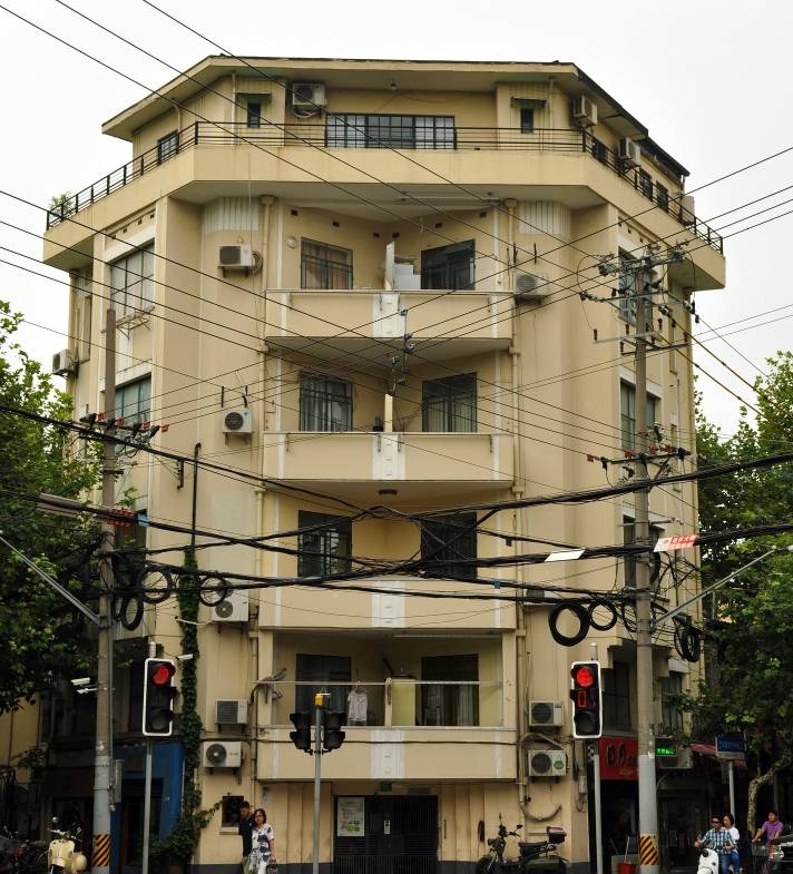2-bed, 1-bath unit at Boissezon Apartment on West Fuxing Road. 145 sqm, outdoor balcony, heritage building (1931), near Shanghai Library Station. 28,600 RMB/month.