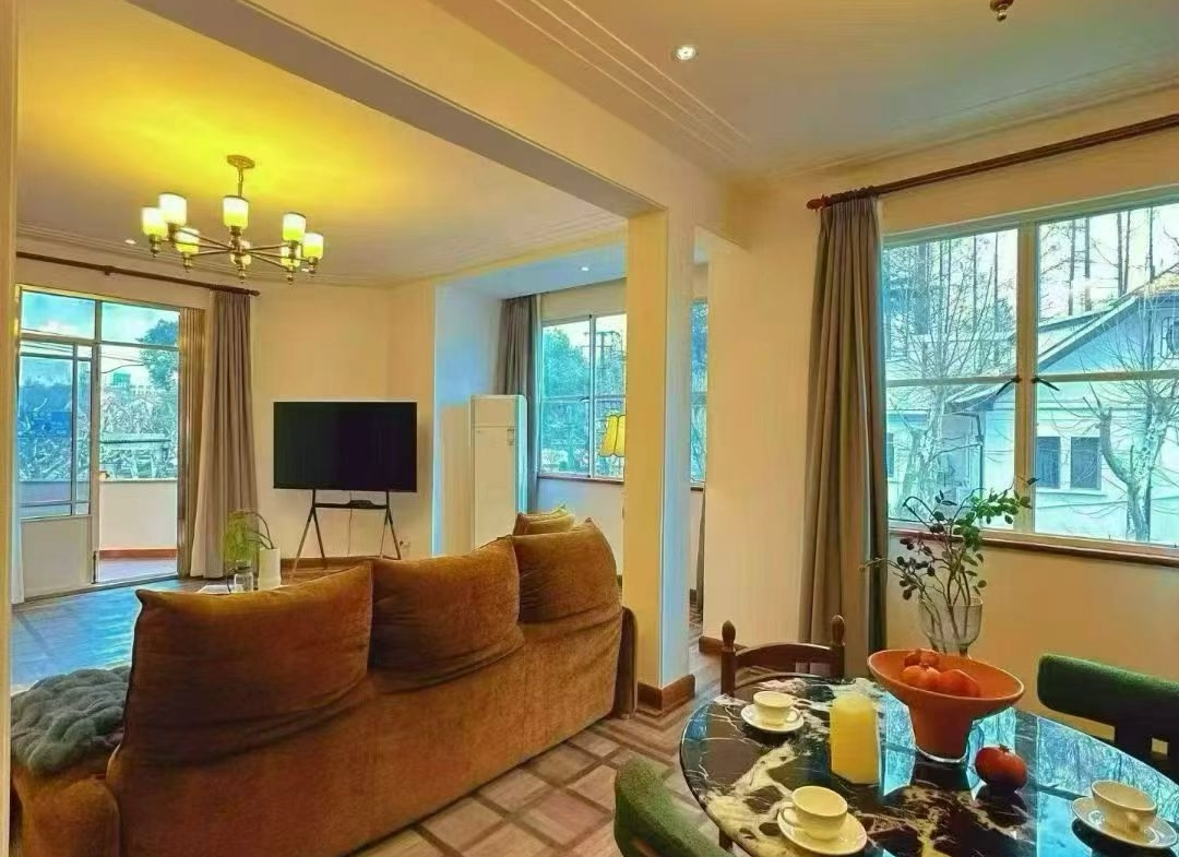 2-bed, 1-bath unit at Boissezon Apartment on West Fuxing Road. 145 sqm, outdoor balcony, heritage building (1931), near Shanghai Library Station. 28,600 RMB/month.