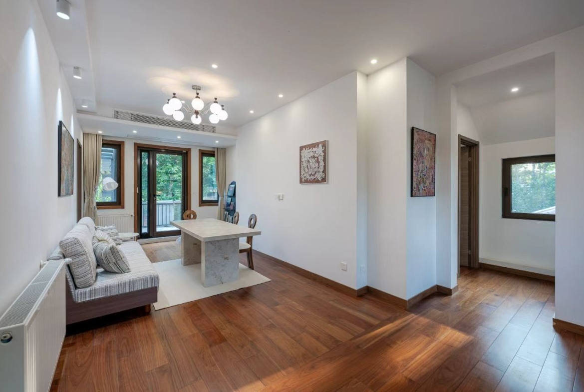 Designer-renovated heritage lane house at 601 Fuxing Middle Road. 3 beds, 2 baths, terrace with awning, attic, central AC, underfloor heating. 32,500 RMB/month.