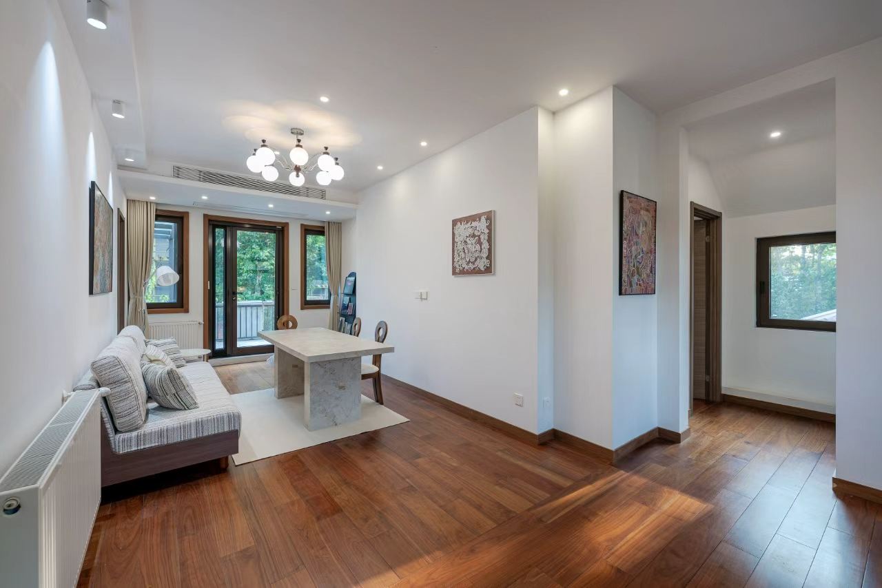 Designer-renovated heritage lane house at 601 Fuxing Middle Road. 3 beds, 2 baths, terrace with awning, attic, central AC, underfloor heating. 32,500 RMB/month.