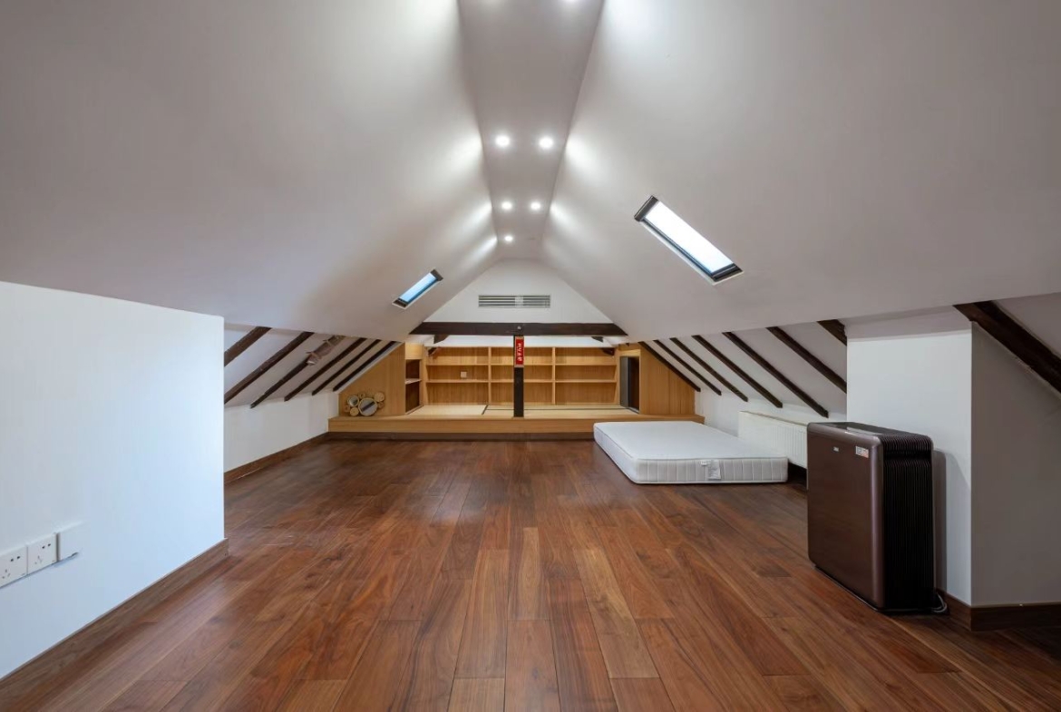 Designer-renovated heritage lane house at 601 Fuxing Middle Road. 3 beds, 2 baths, terrace with awning, attic, central AC, underfloor heating. 32,500 RMB/month.