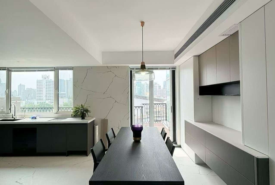 Rare 318 sqm top-floor duplex at Garland Service Apartment (新华嘉利阳光豪庭) in Changning. 4+1 beds, double-height living room, terrace, central AC, floor heating, fresh air. 65,000 RMB/month.