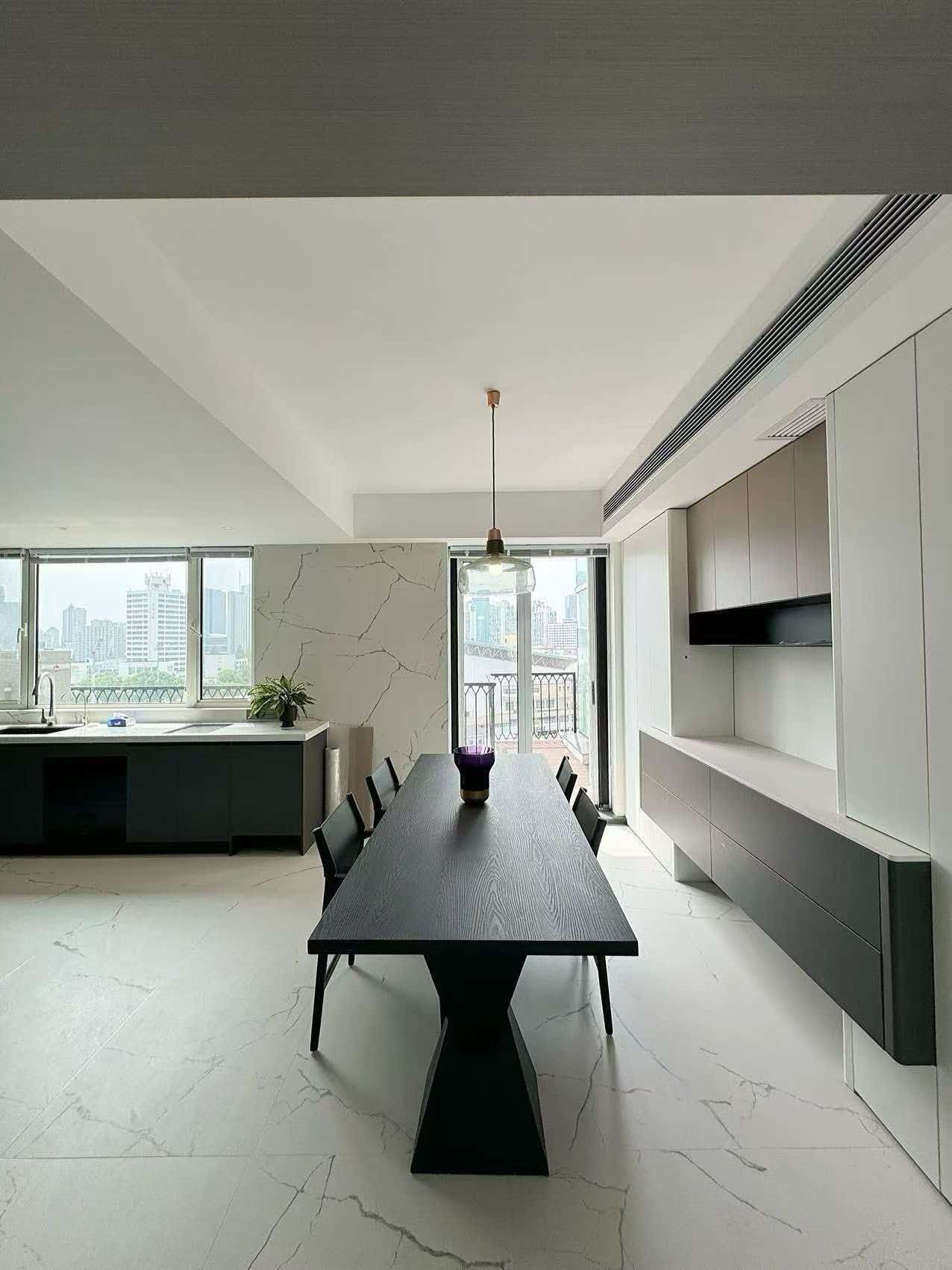 Rare 318 sqm top-floor duplex at Garland Service Apartment (新华嘉利阳光豪庭) in Changning. 4+1 beds, double-height living room, terrace, central AC, floor heating, fresh air. 65,000 RMB/month.