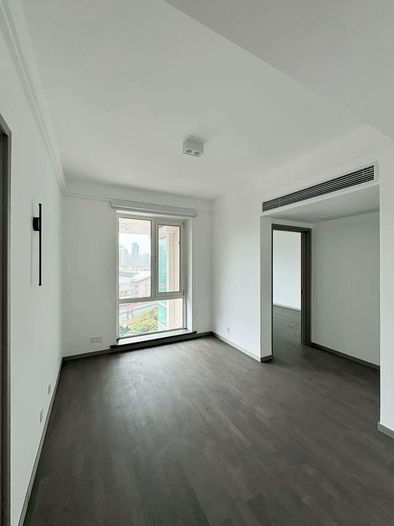 Rare 318 sqm top-floor duplex at Garland Service Apartment (新华嘉利阳光豪庭) in Changning. 4+1 beds, double-height living room, terrace, central AC, floor heating, fresh air. 65,000 RMB/month.