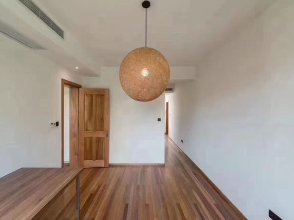 2-bed, 2-bath unit on Huaihai Middle Road near Changshu Road. 120 sqm, 10 sqm balcony, underfloor heating, central AC. Steps from Lines 1, 7, and 10. 13,500 RMB/month.