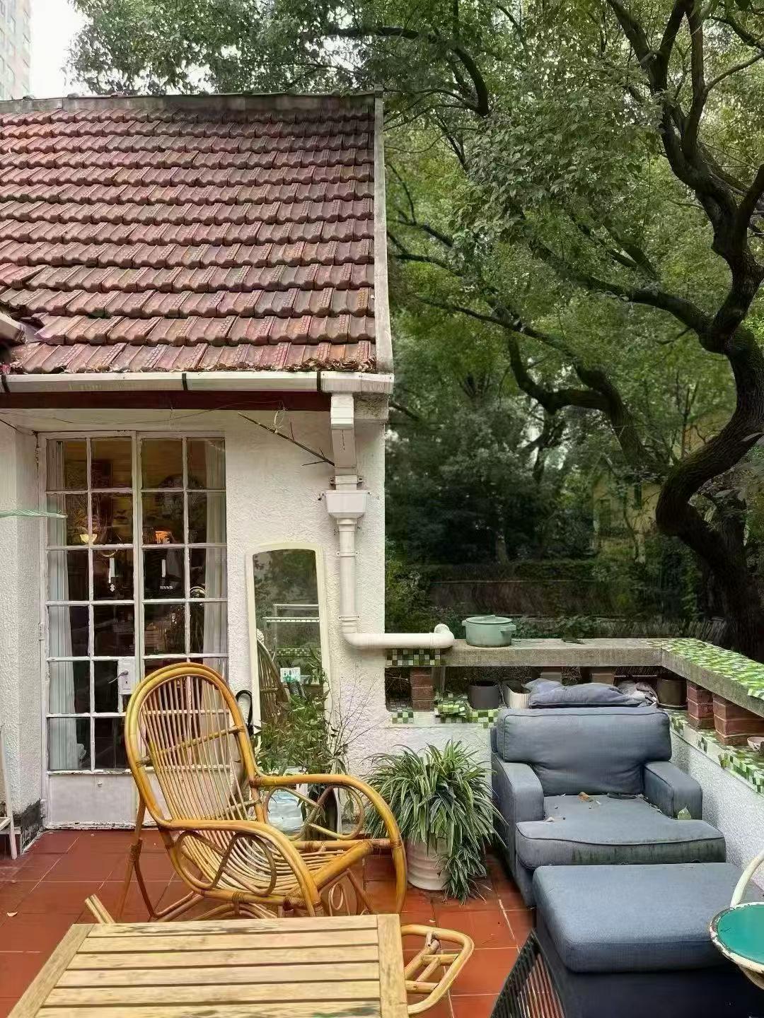 Large 1-bedroom in an English country garden house at Huashan Road and West Fuxing Road. 30 sqm private terrace, three-sided light. Central FFC location. 13,000 RMB/month.