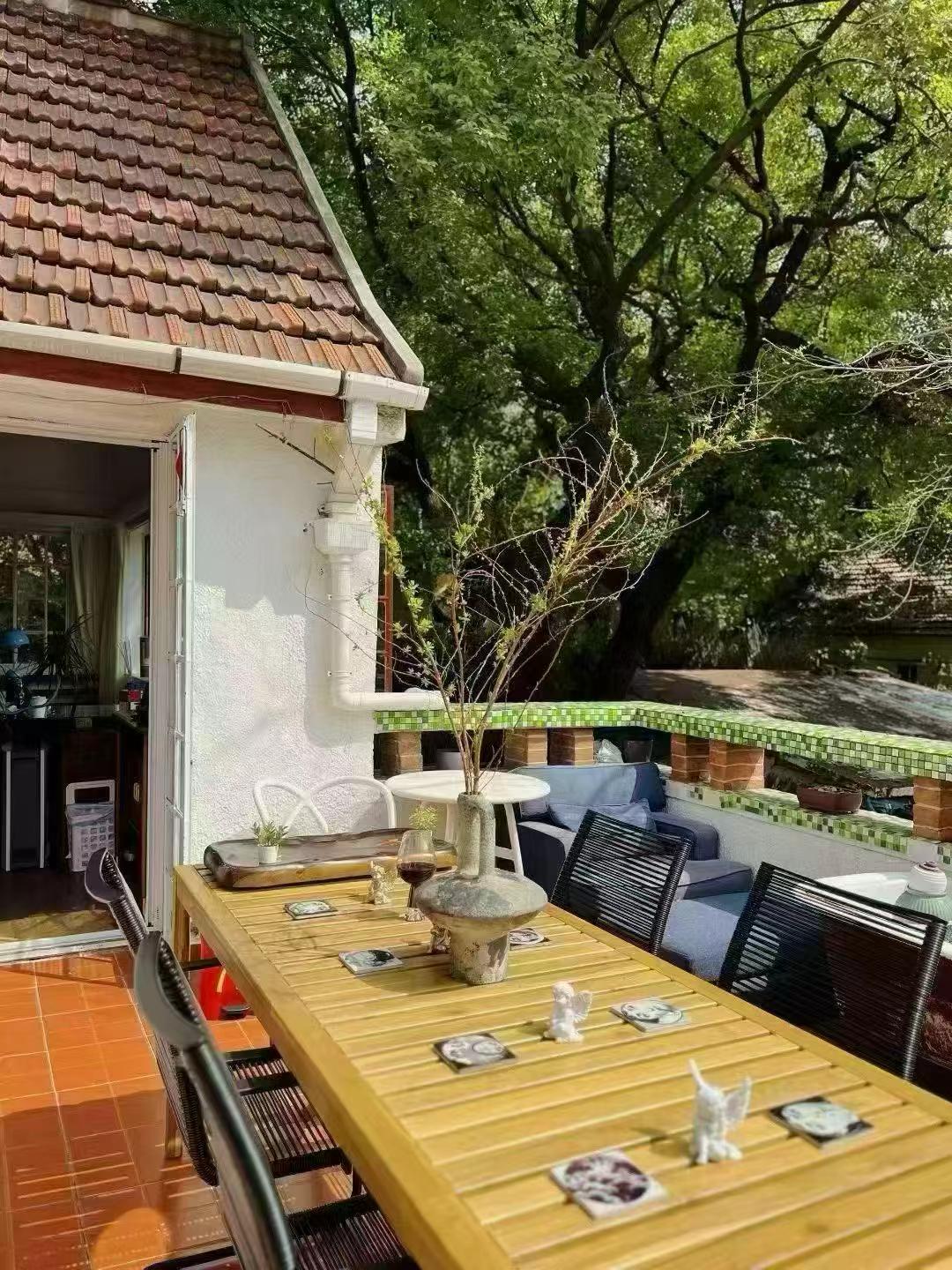 Large 1-bedroom in an English country garden house at Huashan Road and West Fuxing Road. 30 sqm private terrace, three-sided light. Central FFC location. 13,000 RMB/month.
