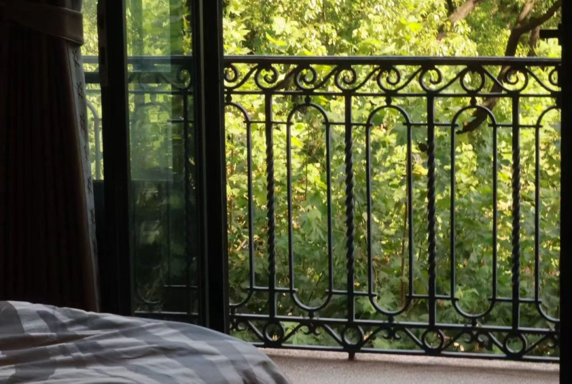 Rare south-facing 1-bed at the Wukang Building. 90 sqm, balcony facing the Soong Ching-ling residence, original fireplace and teak floors, central AC. 28,000 RMB/month.