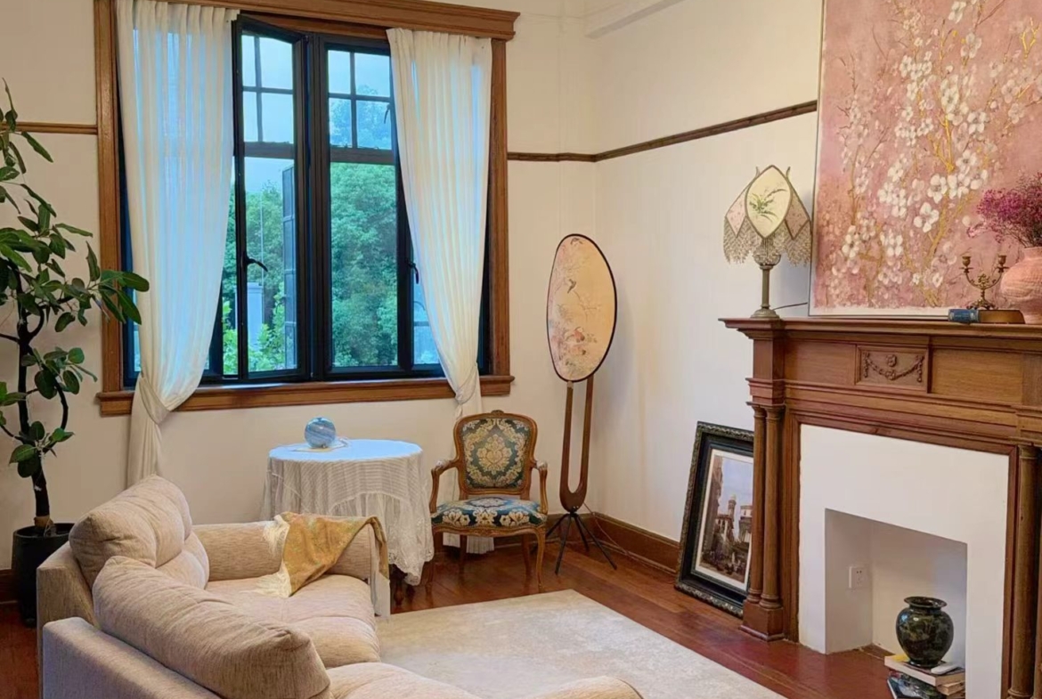 Rare south-facing 1-bed at the Wukang Building. 90 sqm, balcony facing the Soong Ching-ling residence, original fireplace and teak floors, central AC. 28,000 RMB/month.